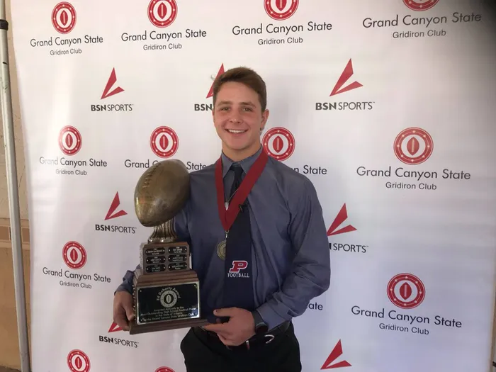 Brock Purdy holding the Ed Doherty Award trophy after winning in 2017