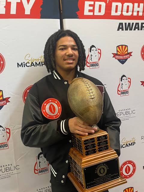 Roye Oliver III holding the Ed Doherty Award trophy after winning in 2025